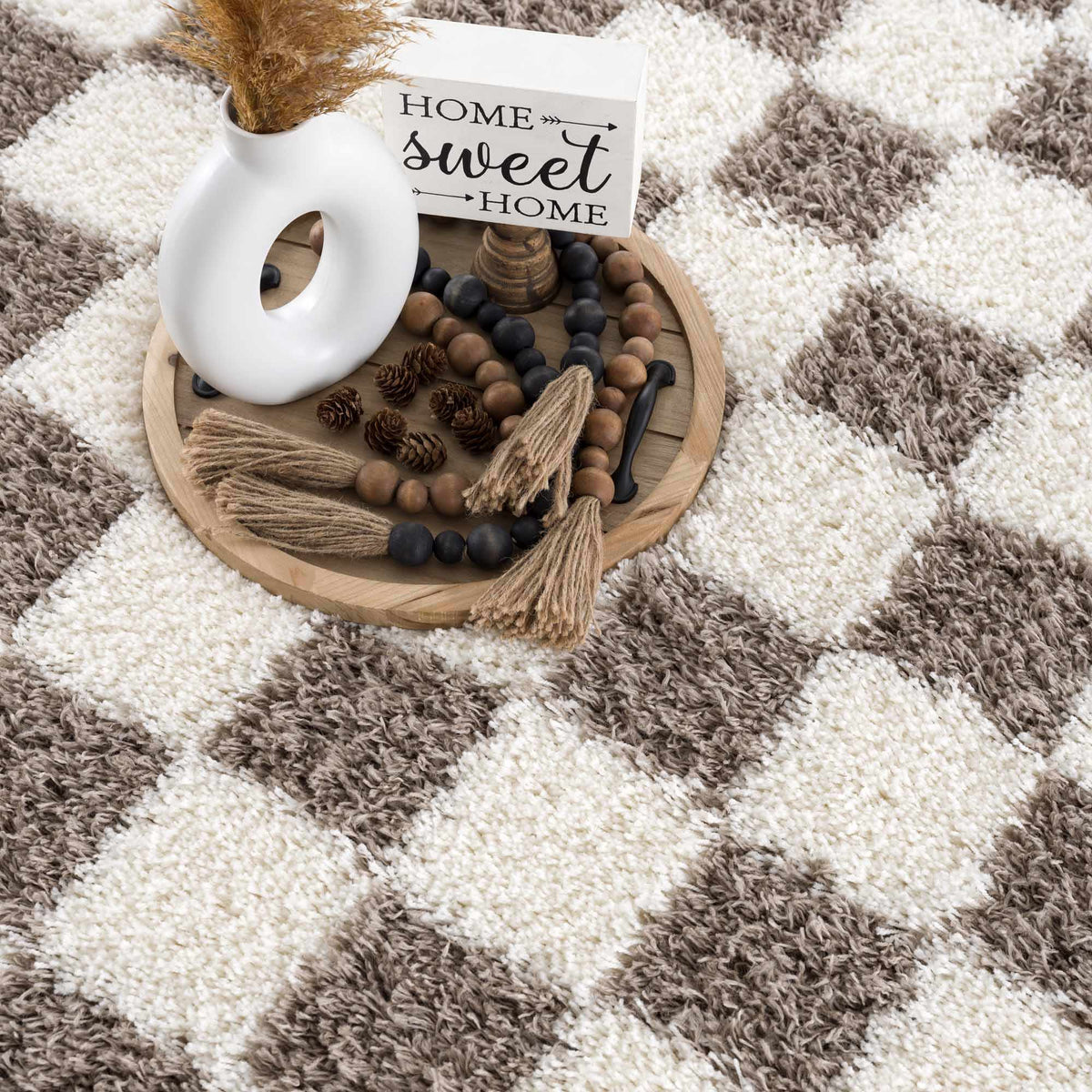 Brown checkered area rug by Boutique Rugs featuring a classic checkered pattern and soft texture, perfect for living room decor.