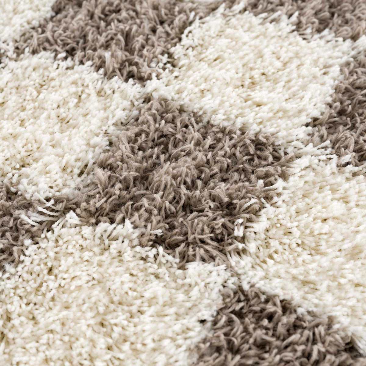 Textured brown checkered area rug by Boutique Rugs featuring a stylish geometric pattern and soft woven texture.