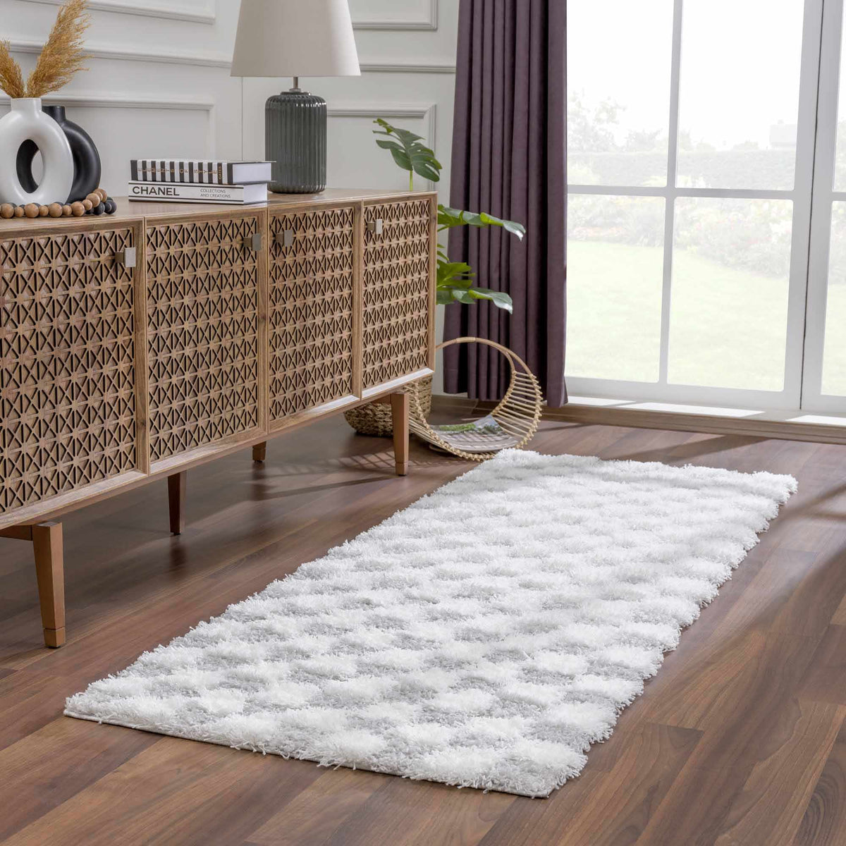 Gray checkered area rug by Boutique Rugs, styled in a room scene with furniture and decor.