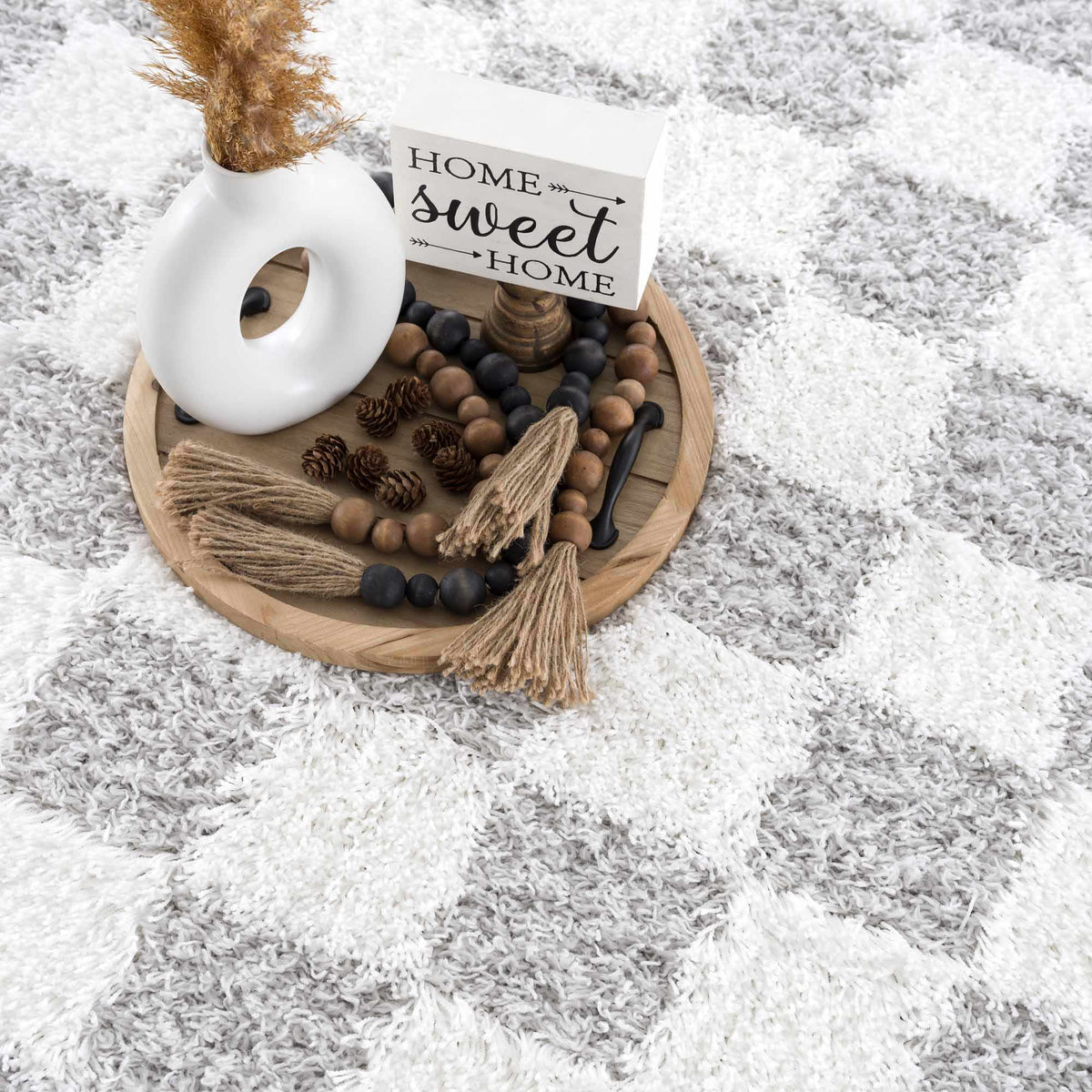 Gray checkered area rug by Boutique Rugs, stylish and soft with a modern pattern, suitable for living rooms or bedrooms.