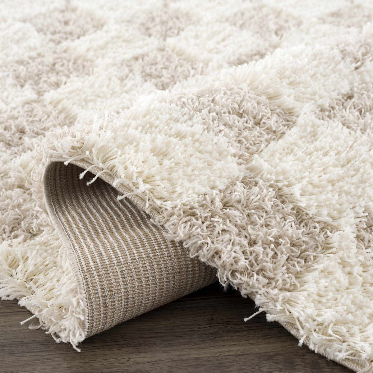 Light brown checkered area rug by Boutique Rugs, showcasing a soft, patterned design suitable for living spaces.