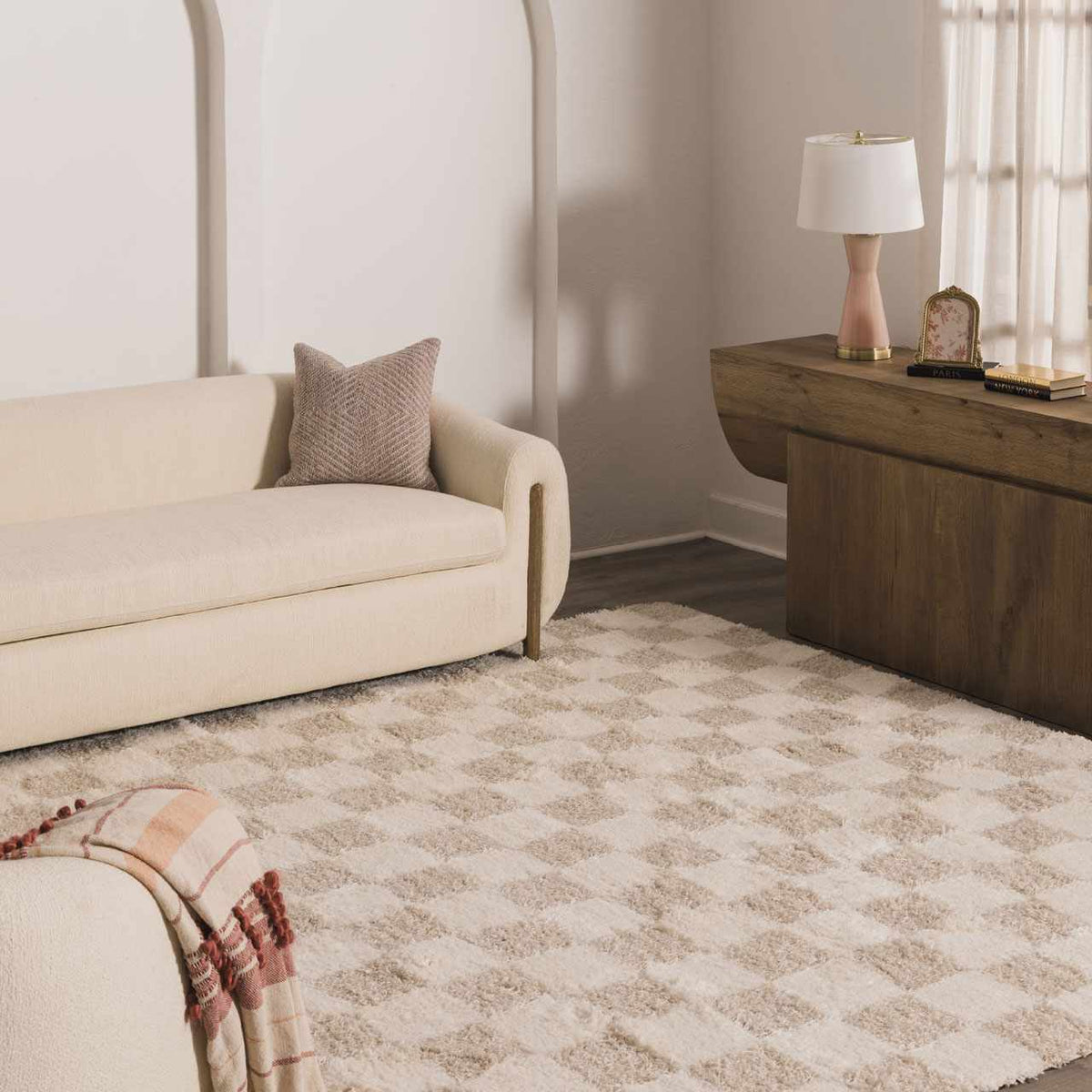 Light brown checkered area rug by Boutique Rugs displayed in a room scene, showcasing its pattern and soft texture.