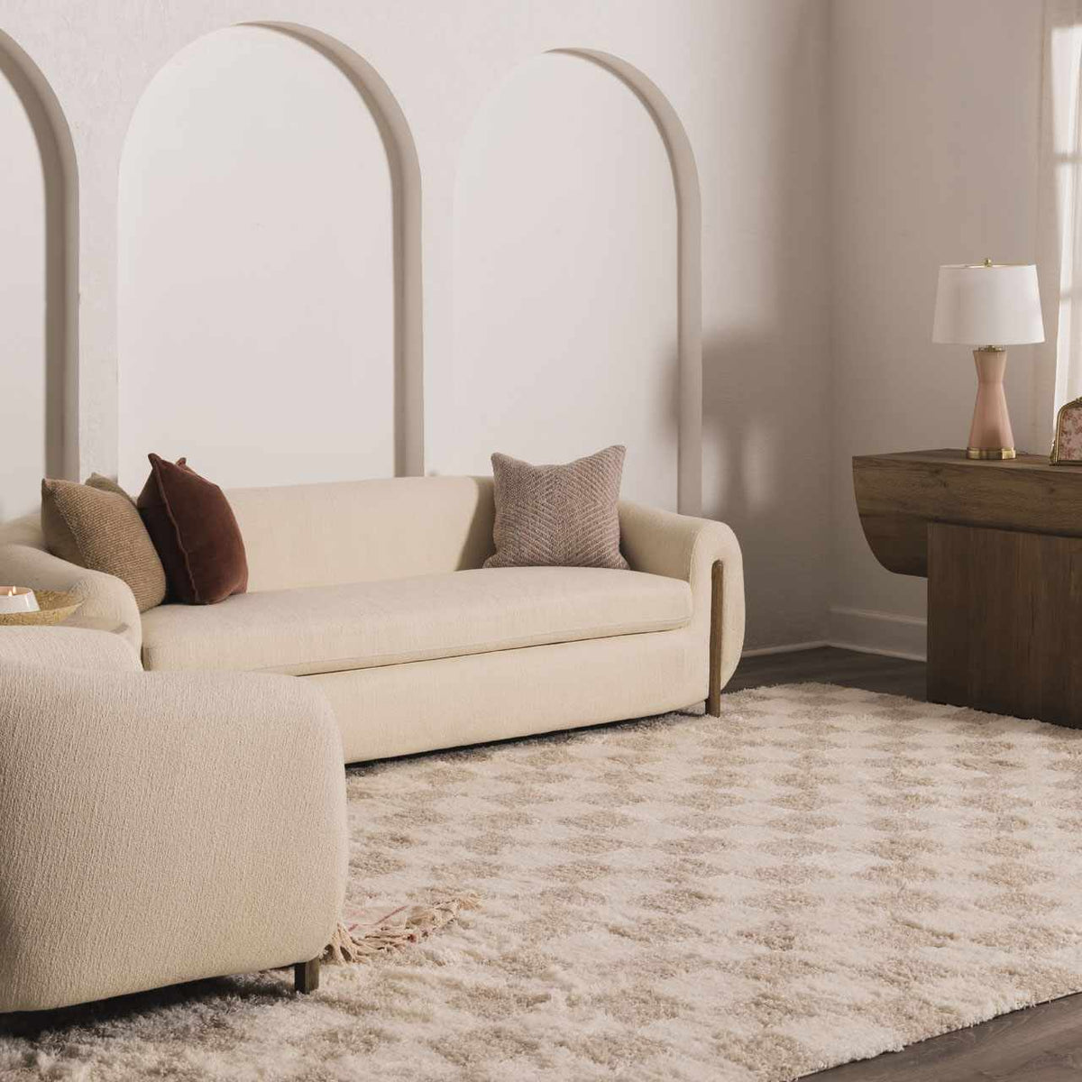 Light brown checkered area rug by Boutique Rugs, shown in a cozy room setting with furniture and decor.