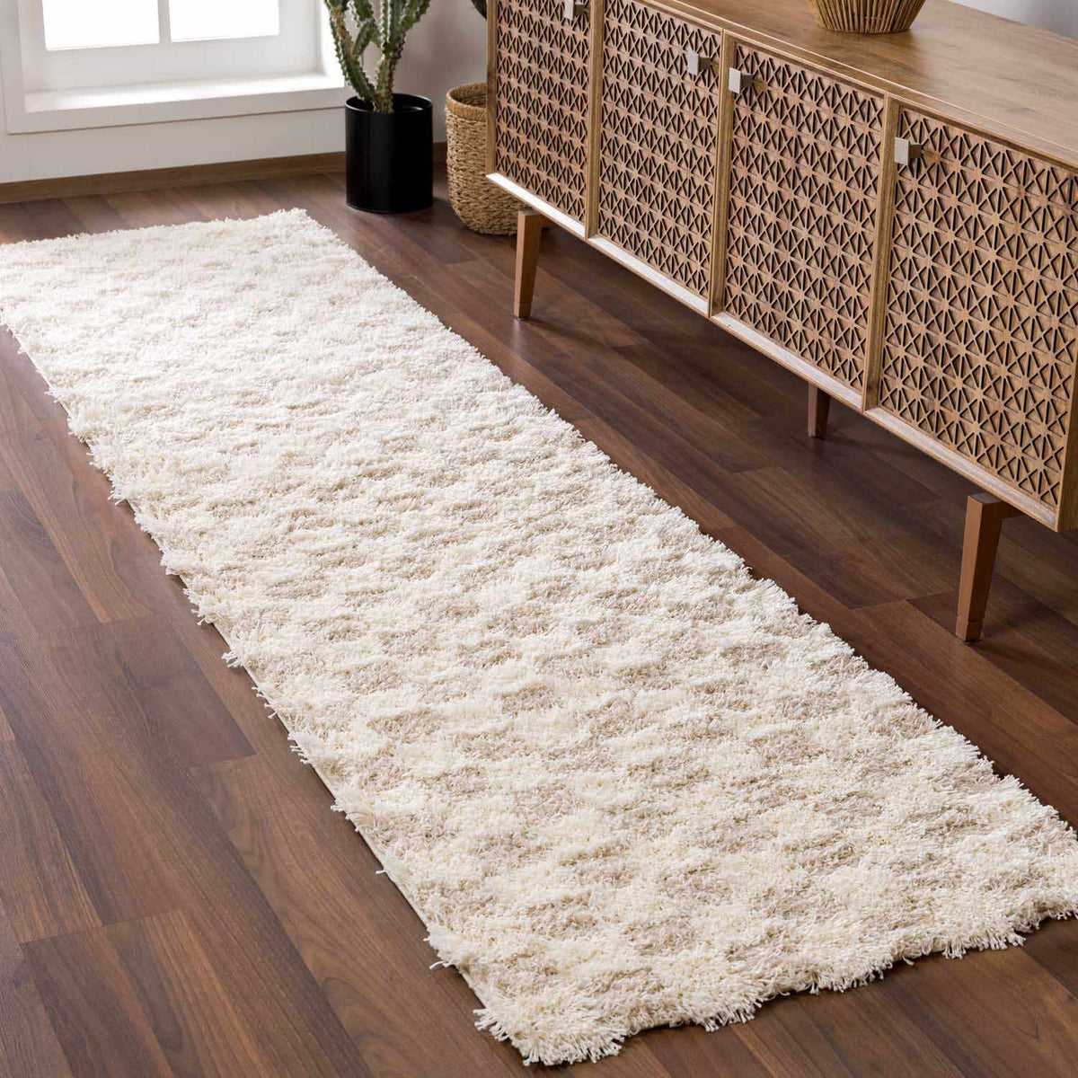 Light brown checkered area rug by Boutique Rugs, shown in a stylish room scene with a cozy, modern decor setup.