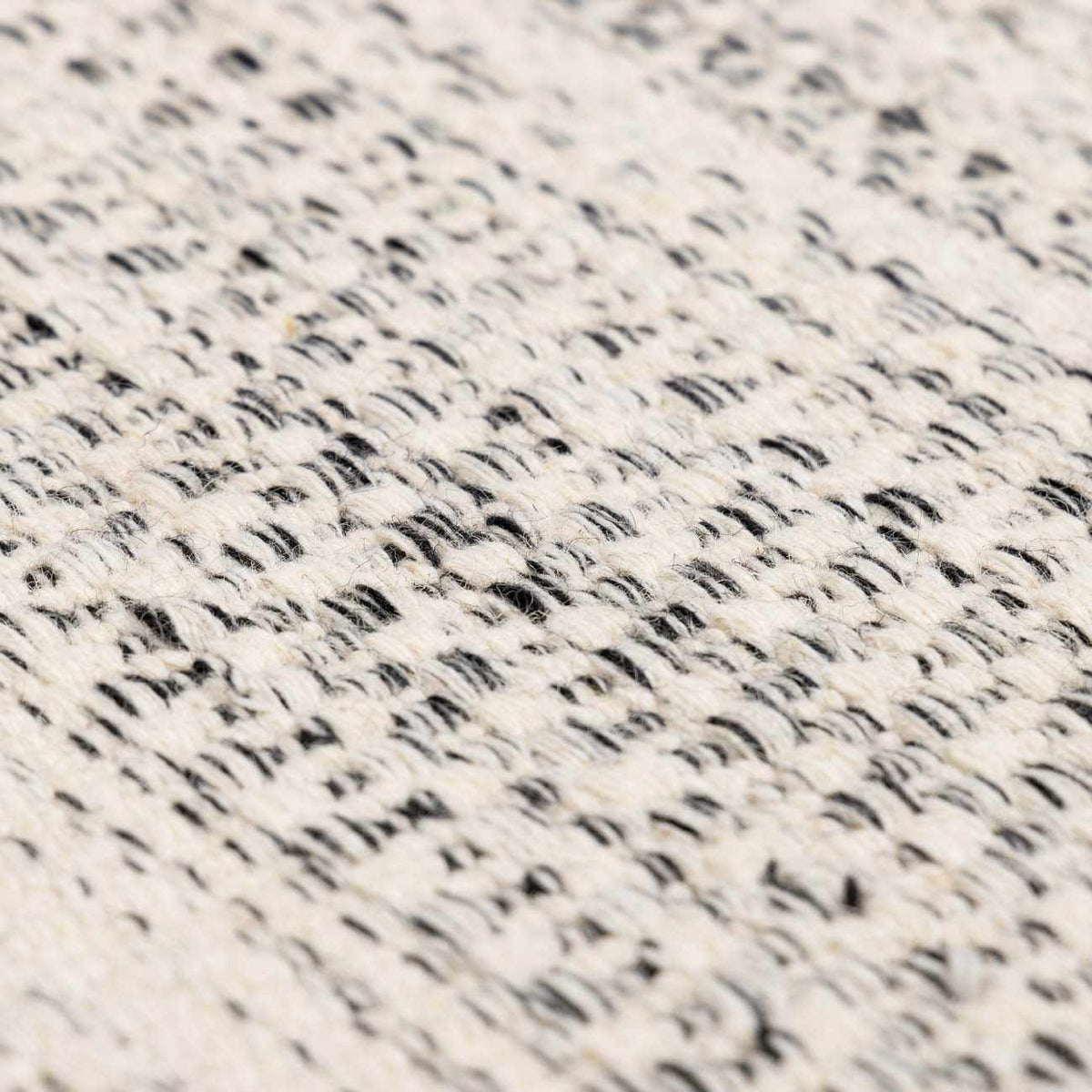 Williford Wool Area Rug by Hauteloom featuring a textured, neutral-toned design with intricate patterns for stylish home decor.