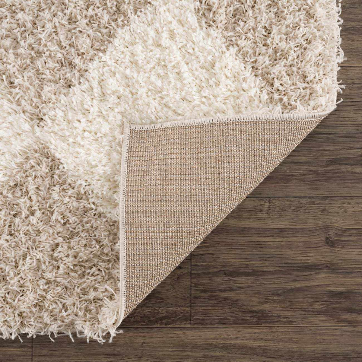 Cream and beige diamond-patterned area rug by Hauteloom, showcasing soft woven texture and intricate geometric design.