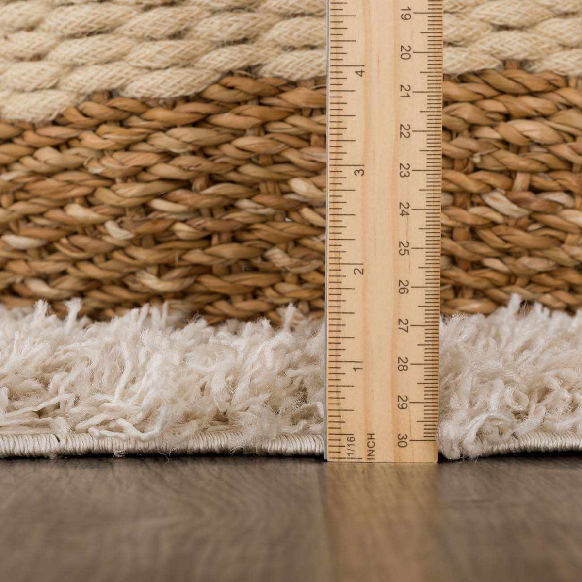 Cream and beige diamond pattern area rug by Hauteloom, showcasing soft pile and elegant design in a cozy living space.