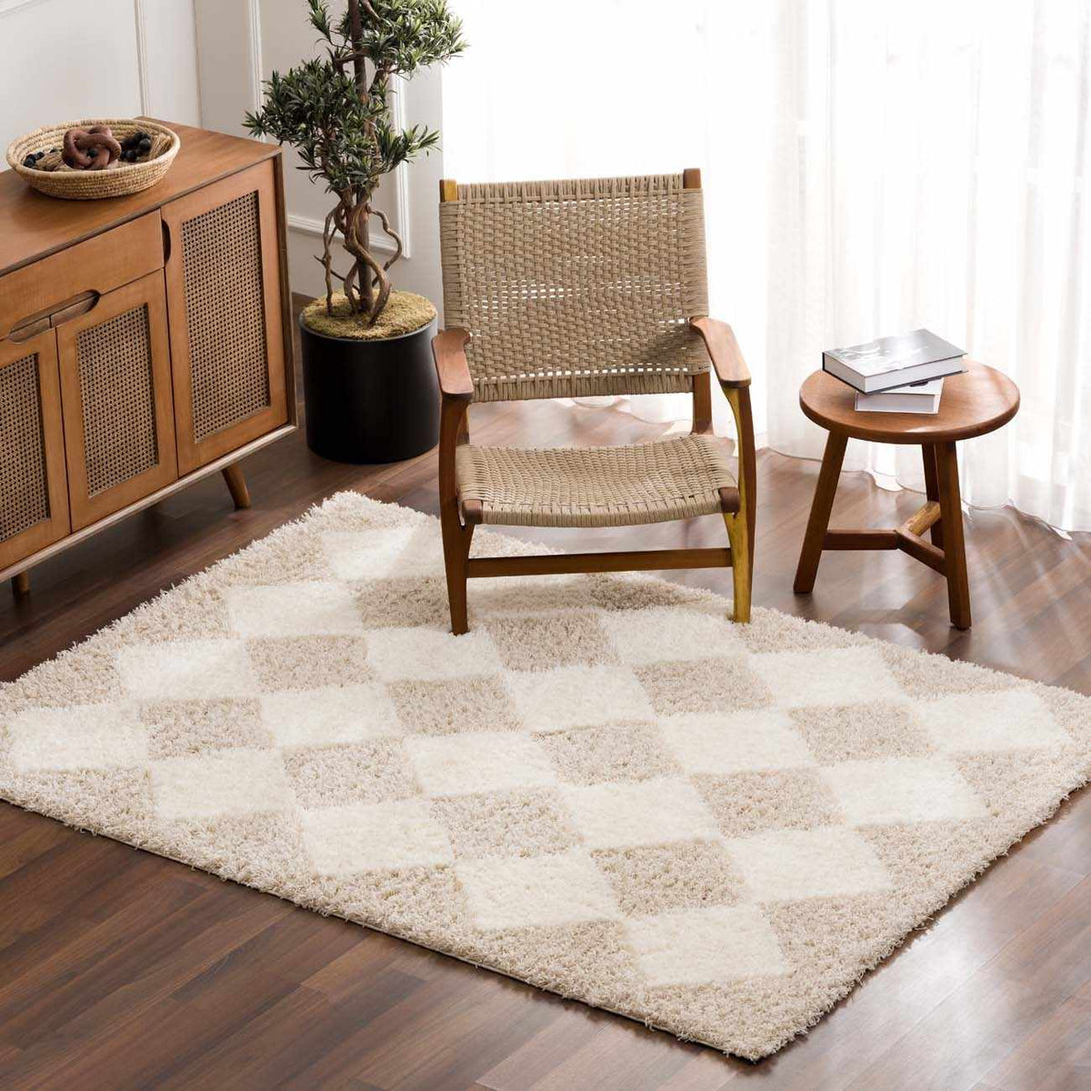 Hauteloom Zahur cream and beige diamond area rug displayed in a cozy living room setting, showcasing soft texture and elegant pattern.