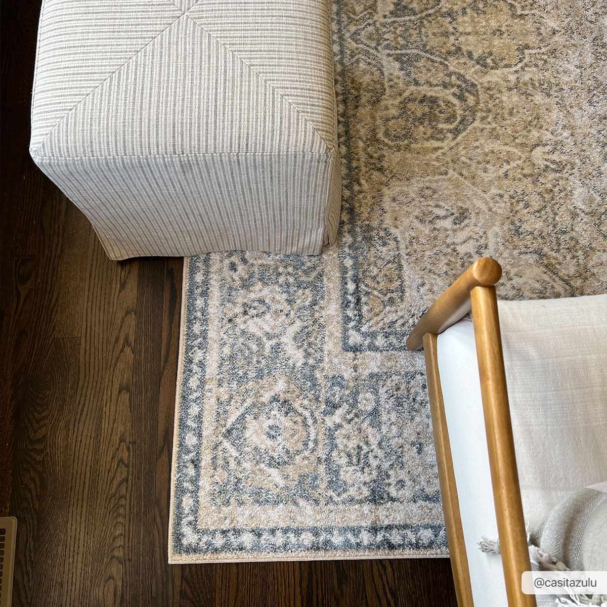 Cream and blue washable rug from Arias Boutique Rugs, showcasing a soft, patterned area rug with floral design.