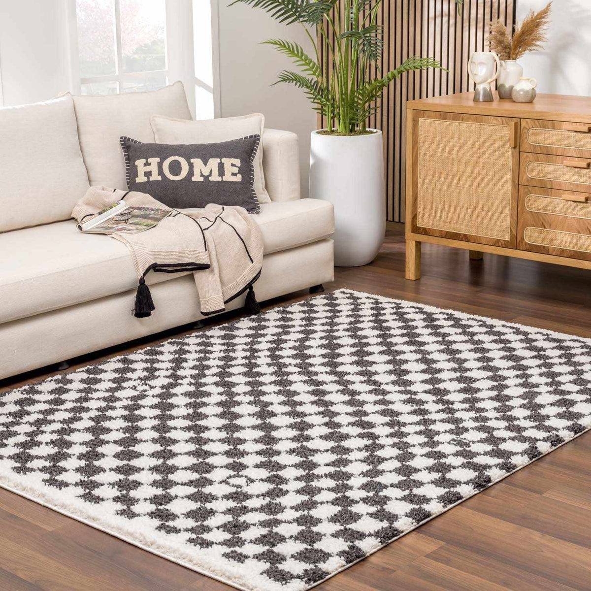 Black and white checkered shag rug from Boutique Rugs, showcasing a plush texture and bold geometric pattern.