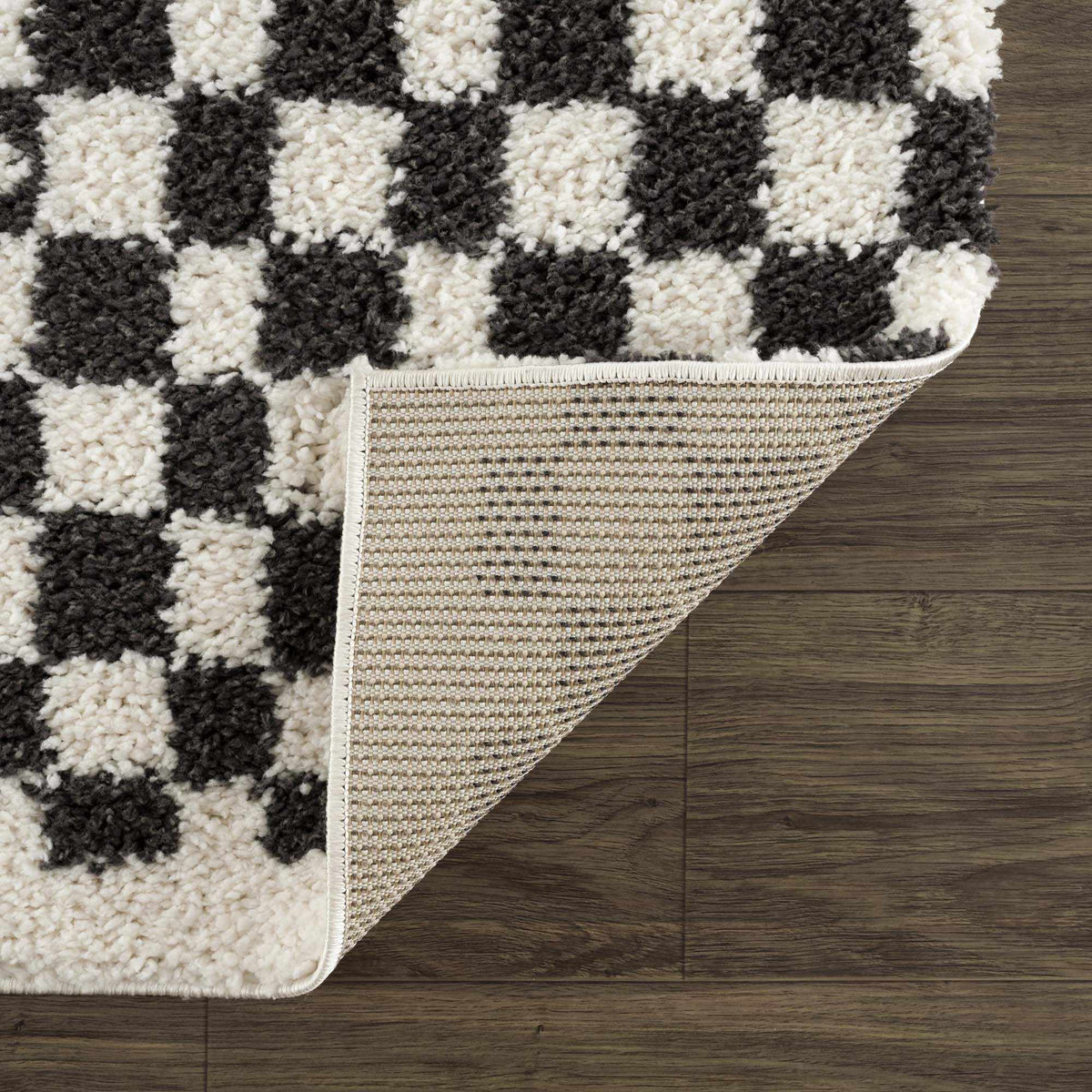 Black and white checkered shag rug from Boutique Rugs featuring soft, plush fibers and a modern checkered pattern for stylish flooring.