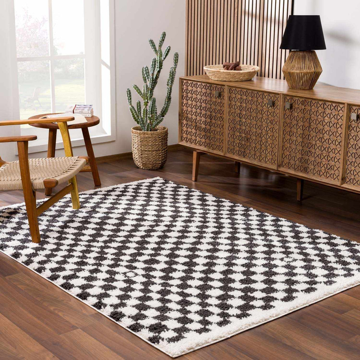 Black and white checkered shag rug from Boutique Rugs, cozy room scene showing plush, textured design in modern decor.