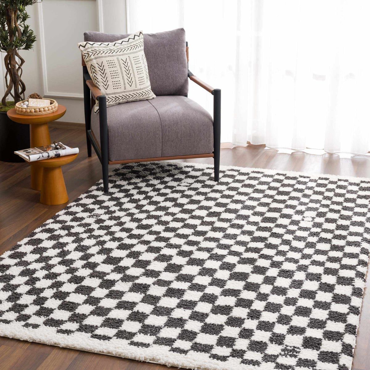 Black and white checkered shag rug by Boutique Rugs, cozy textured rug on a room floor with modern style.