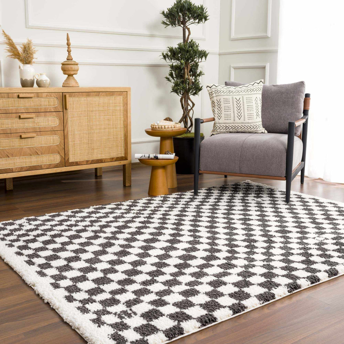 Black and white checkered shag rug by Boutique Rugs, showcasing a plush, textured surface in a modern room setting.