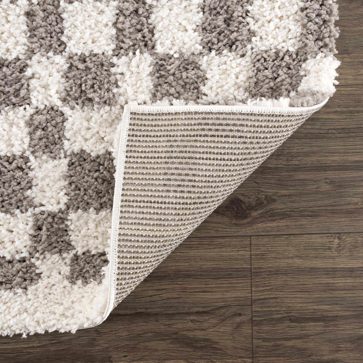 Taupe checkered plush rug by Boutique Rugs, showcasing soft, textured fabric with a stylish plaid pattern and cozy design.