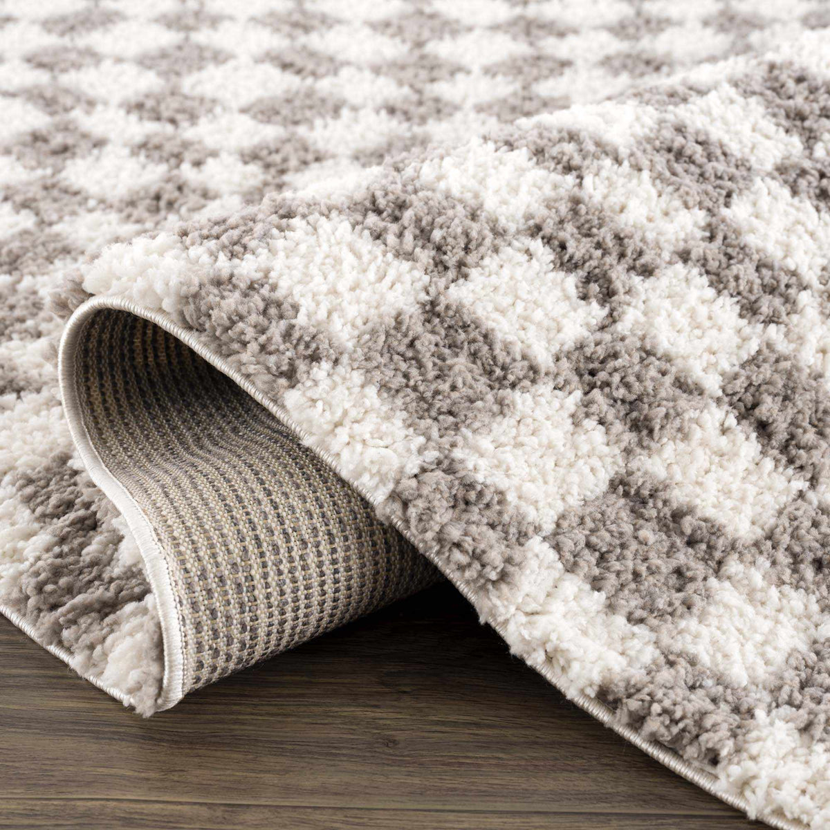 Taupe checkered plush rug by Boutique Rugs, featuring soft, textured fabric with a cozy, stylish checkered pattern.