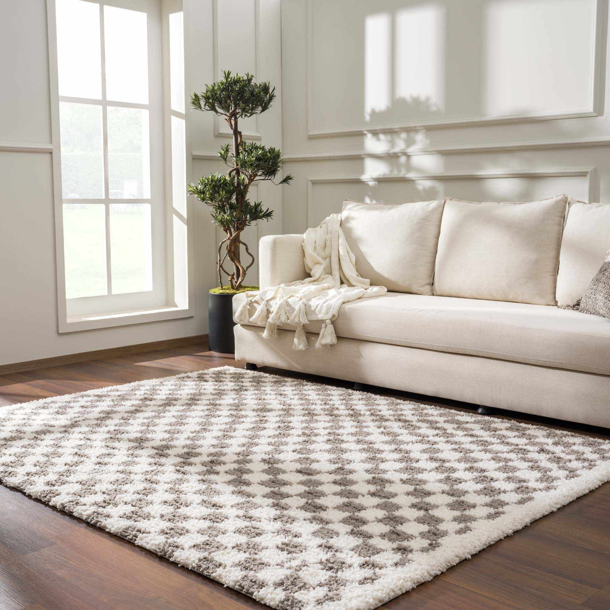 Taupe checkered plush rug by Boutique Rugs, shown in a cozy room scene with soft texture and stylish pattern.