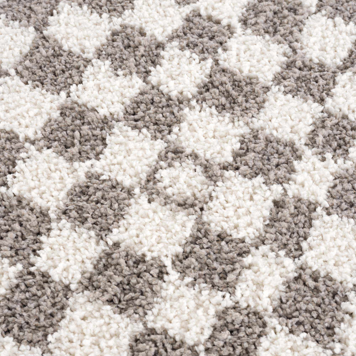 Kieu Taupe Checkered Plush Rug by Boutique Rugs, soft textured taupe and checkered design, close-up of plush fabric.
