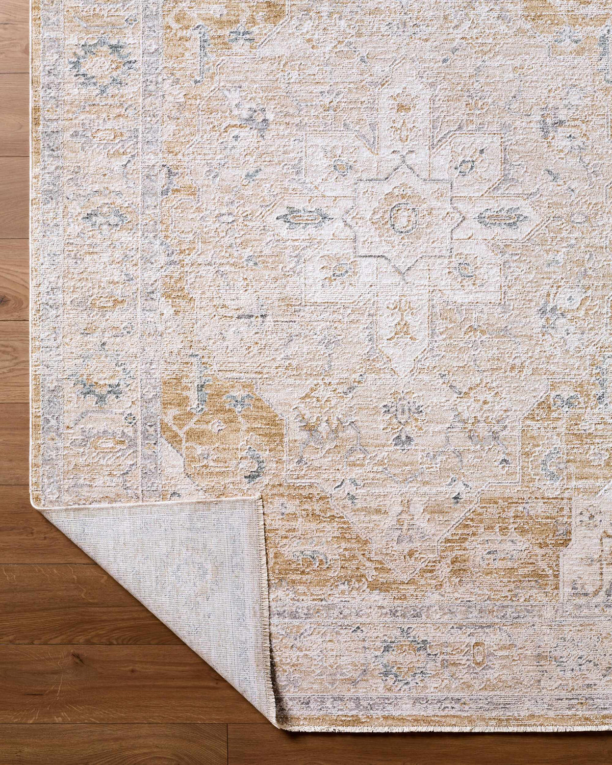 Boutique Rugs Rhody Luxe Rug in soft, plush texture with a folded corner showing intricate design and rich colors.