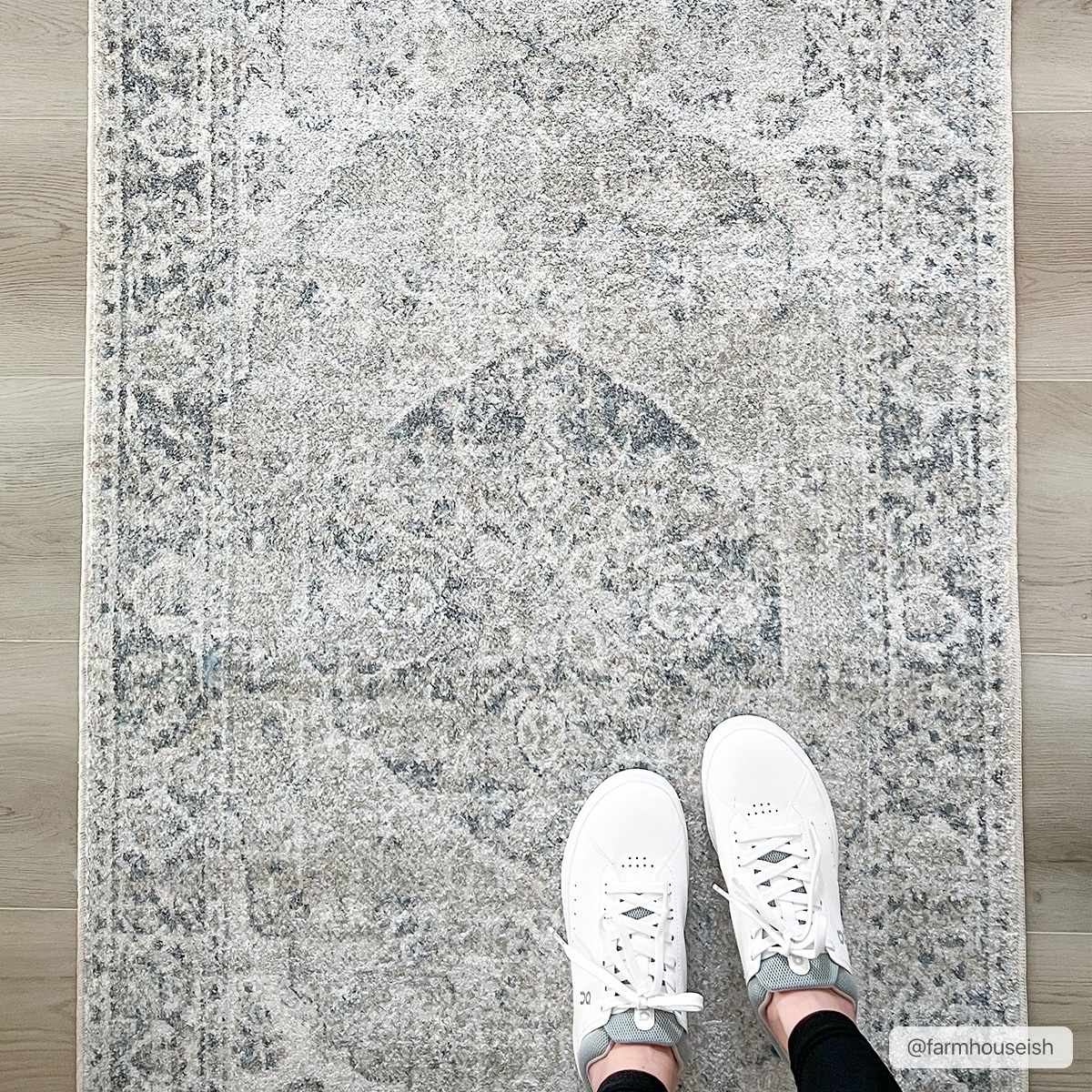 Blue washable farmhouse-style area rug by Boutique Rugs, featuring a rustic pattern and soft texture for cozy home decor.