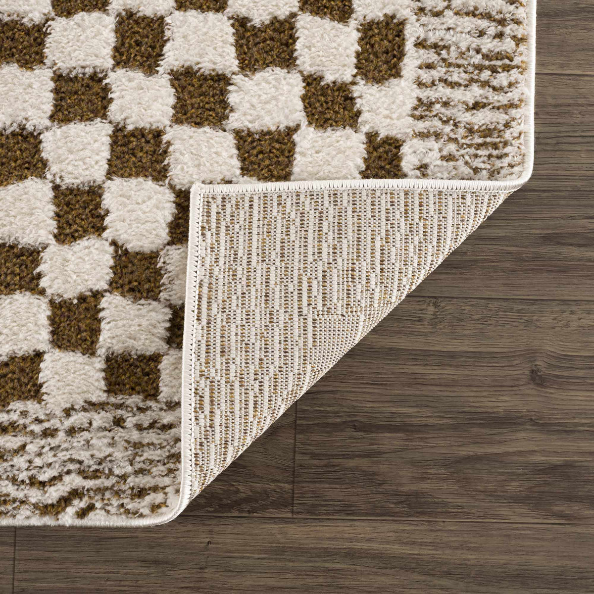 Leryn Brown Checkered Plush Rug from Boutique Rugs, showing a folded soft, plush rug with a brown checkered pattern.