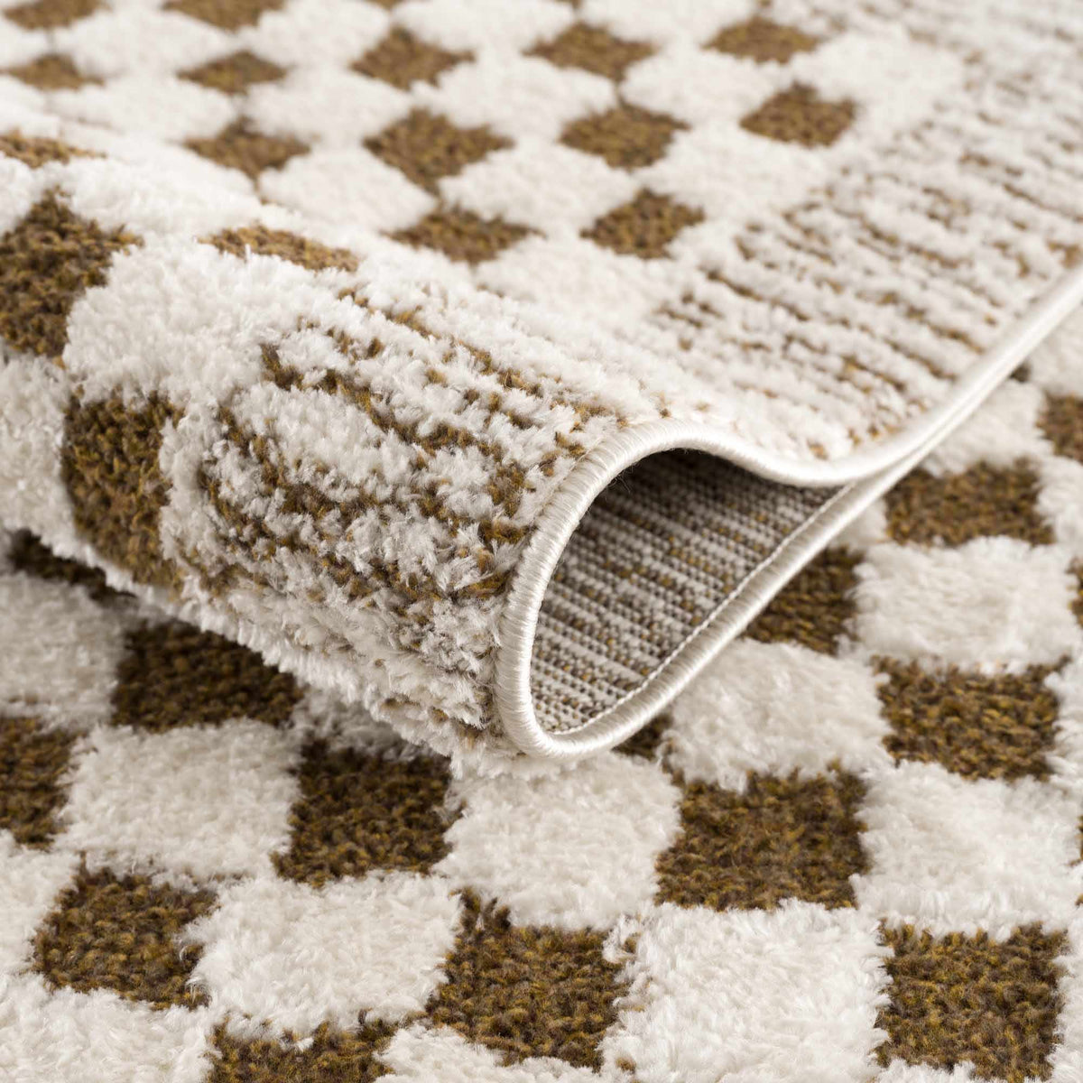 Leryn Brown checkered plush rug from Boutique Rugs, showing a soft, cozy fabric with a modern brown and beige checkered pattern.