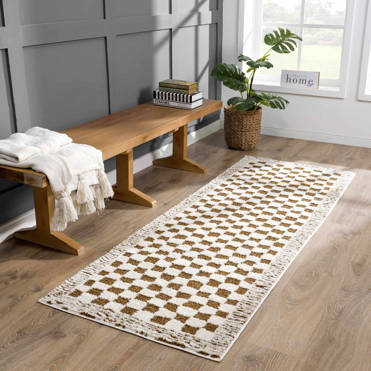 Checkered plush rug in warm brown tones from Boutique Rugs, shown in a cozy room setting with furniture and decor.