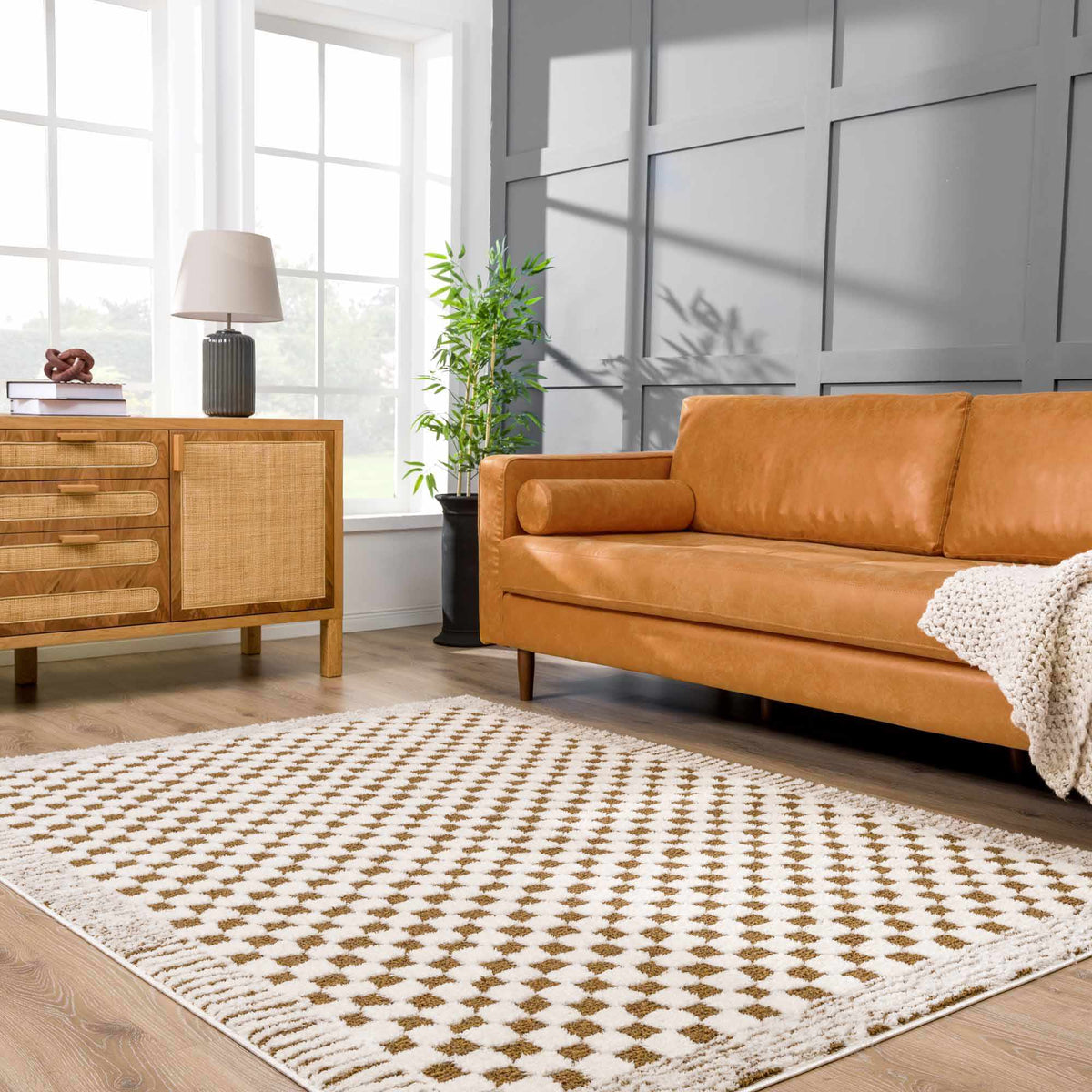 Leryn Brown checkered plush rug from Boutique Rugs displayed in a cozy living room setting.