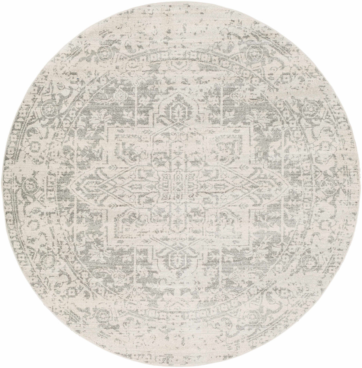 Hauteloom Rachel area rug with intricate geometric patterns in warm tones, soft pile, suitable for living room or bedroom decor.