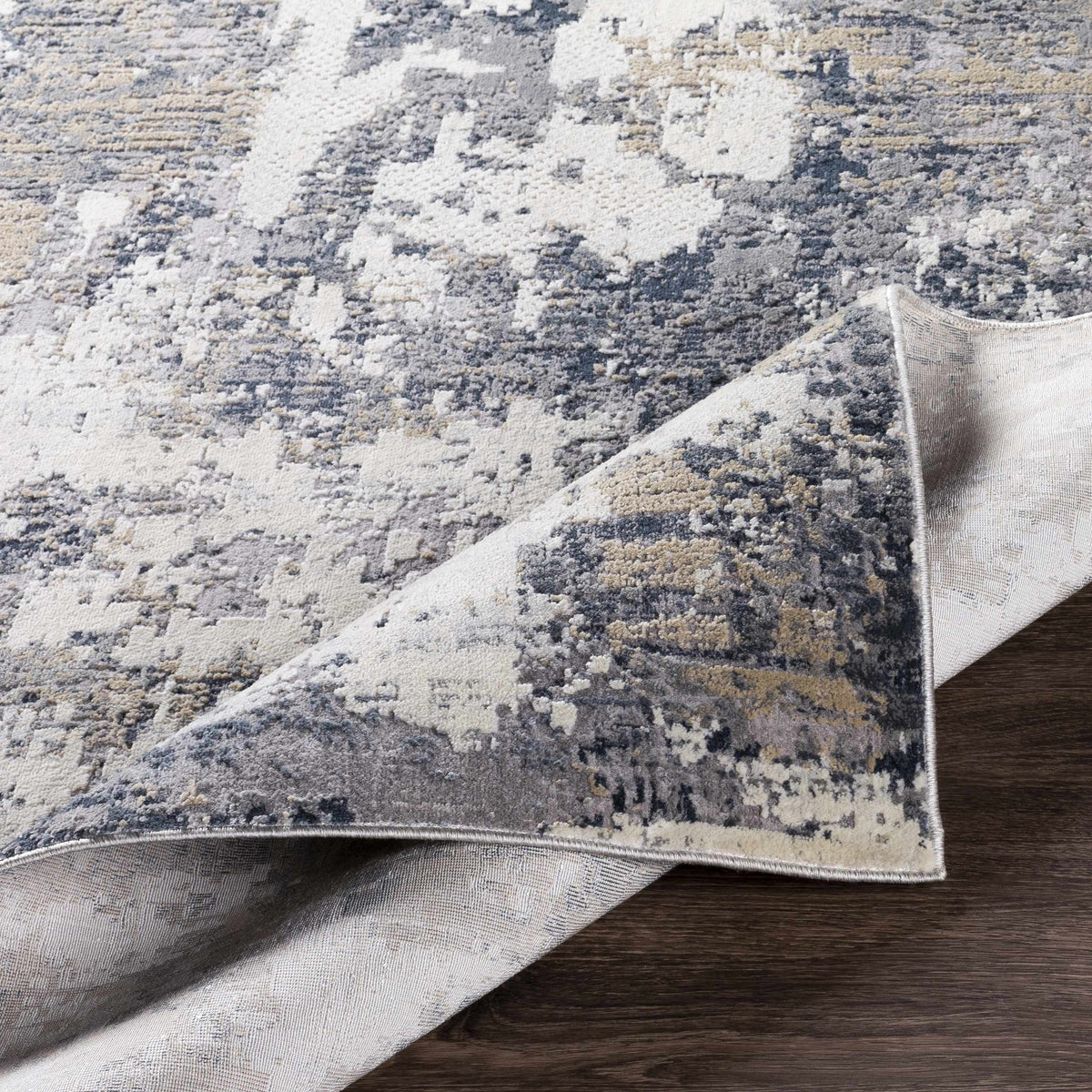 Textured Luxe Islington Area Rug by Boutique Rugs, folded to showcase its soft, intricate pattern and plush surface.