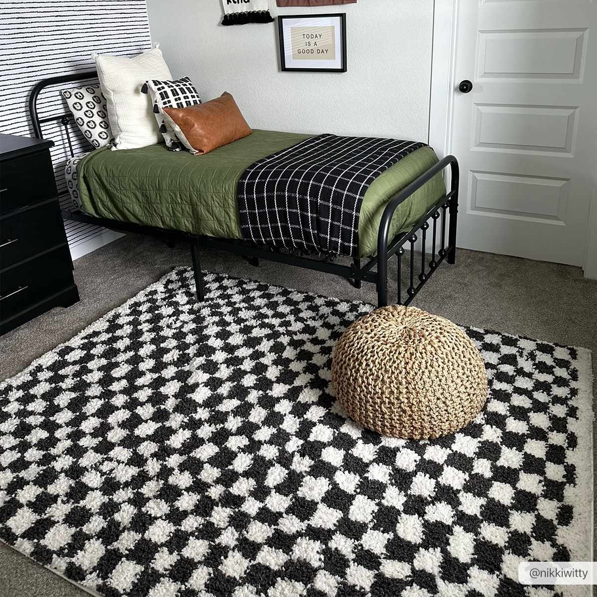 Black and white checkered shag rug by Boutique Rugs, showcasing a soft, textured surface with a modern checkered pattern.