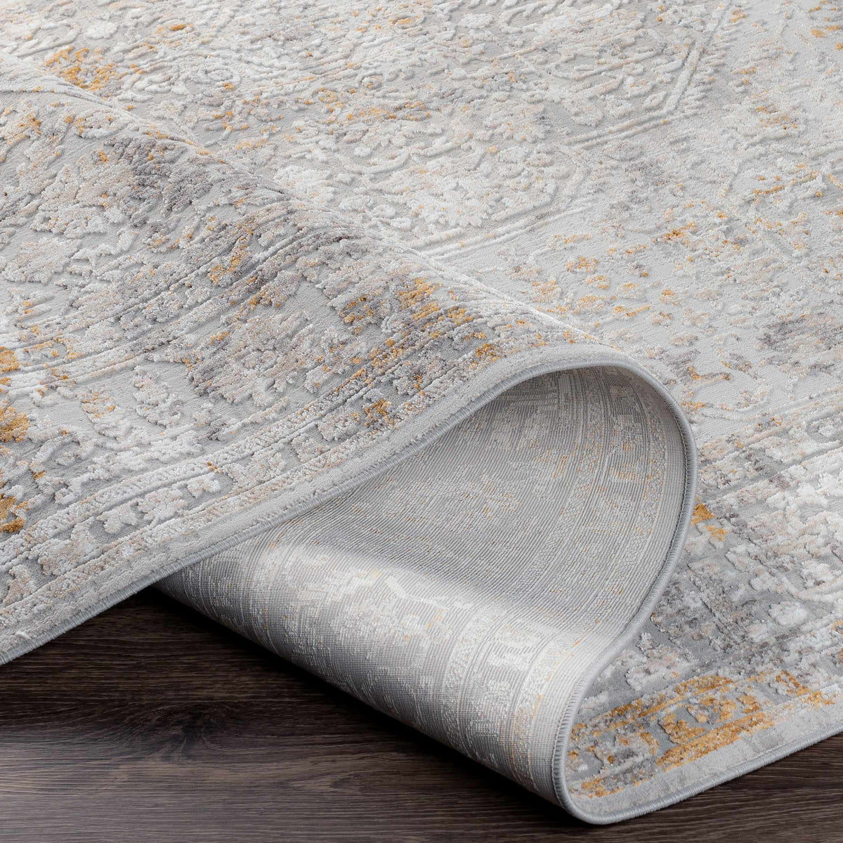 Kolin Textured Luxe Area Rug by Boutique Rugs, featuring a folded view showcasing its textured design and plush surface.