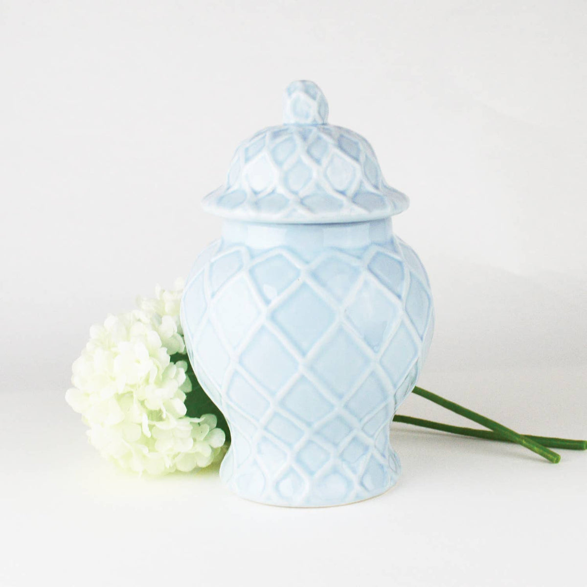 Three light blue textured ginger jars in varied sizes, showcasing elegant ceramic design by Shop Holly J Home.