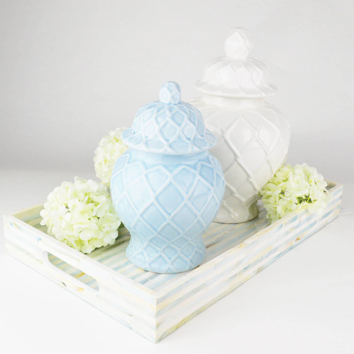 Three light blue textured ginger jars in varying sizes, showcasing decorative ceramic design by Shop Holly J Home.