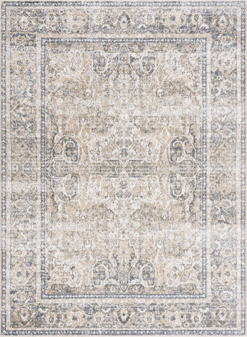 A washable Boutique Rugs area rug with geometric design in neutral tones, displayed on a hardwood floor.