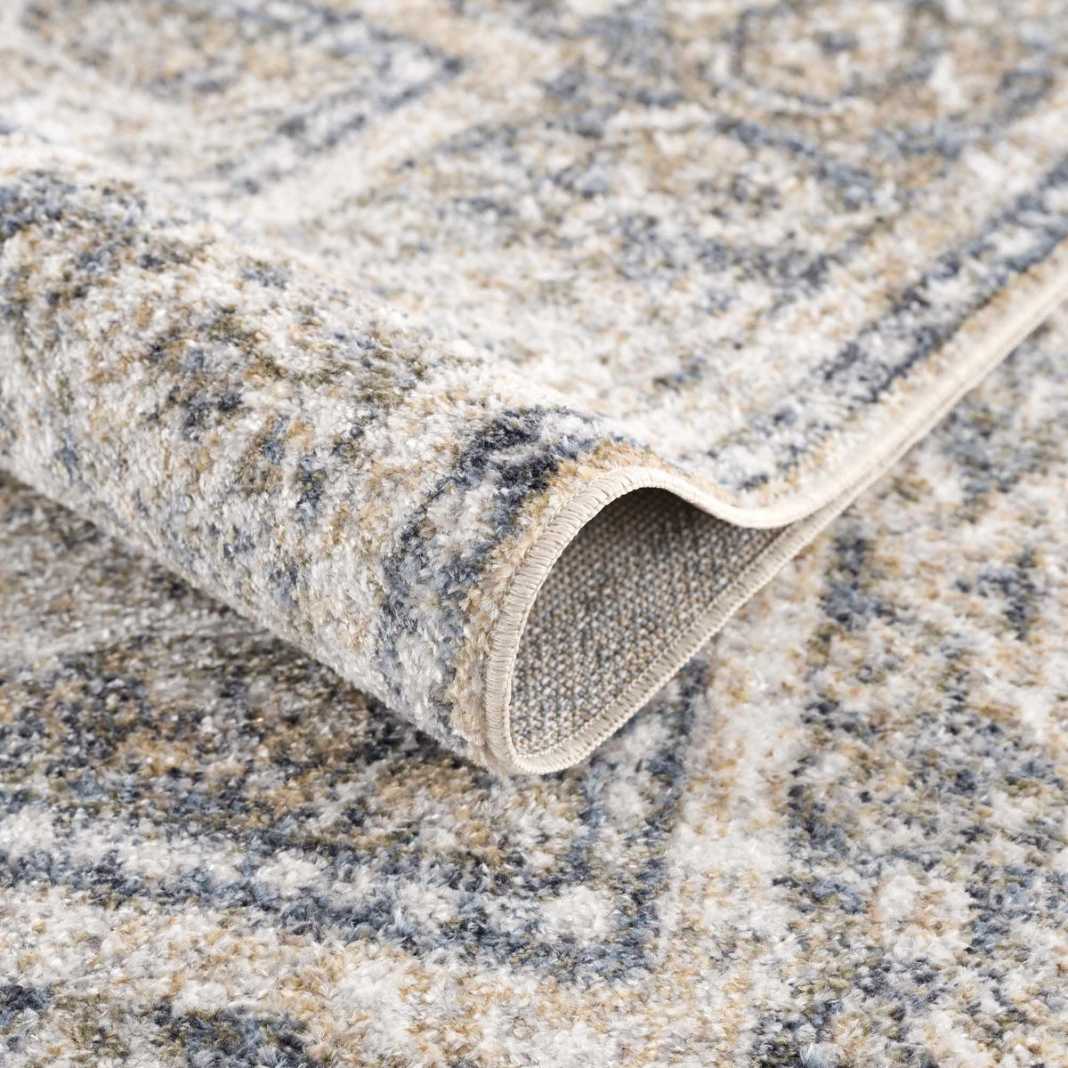 Folded Arias Boutique washable rug from Boutique Rugs, showcasing its soft fabric and stylish design for home decor.