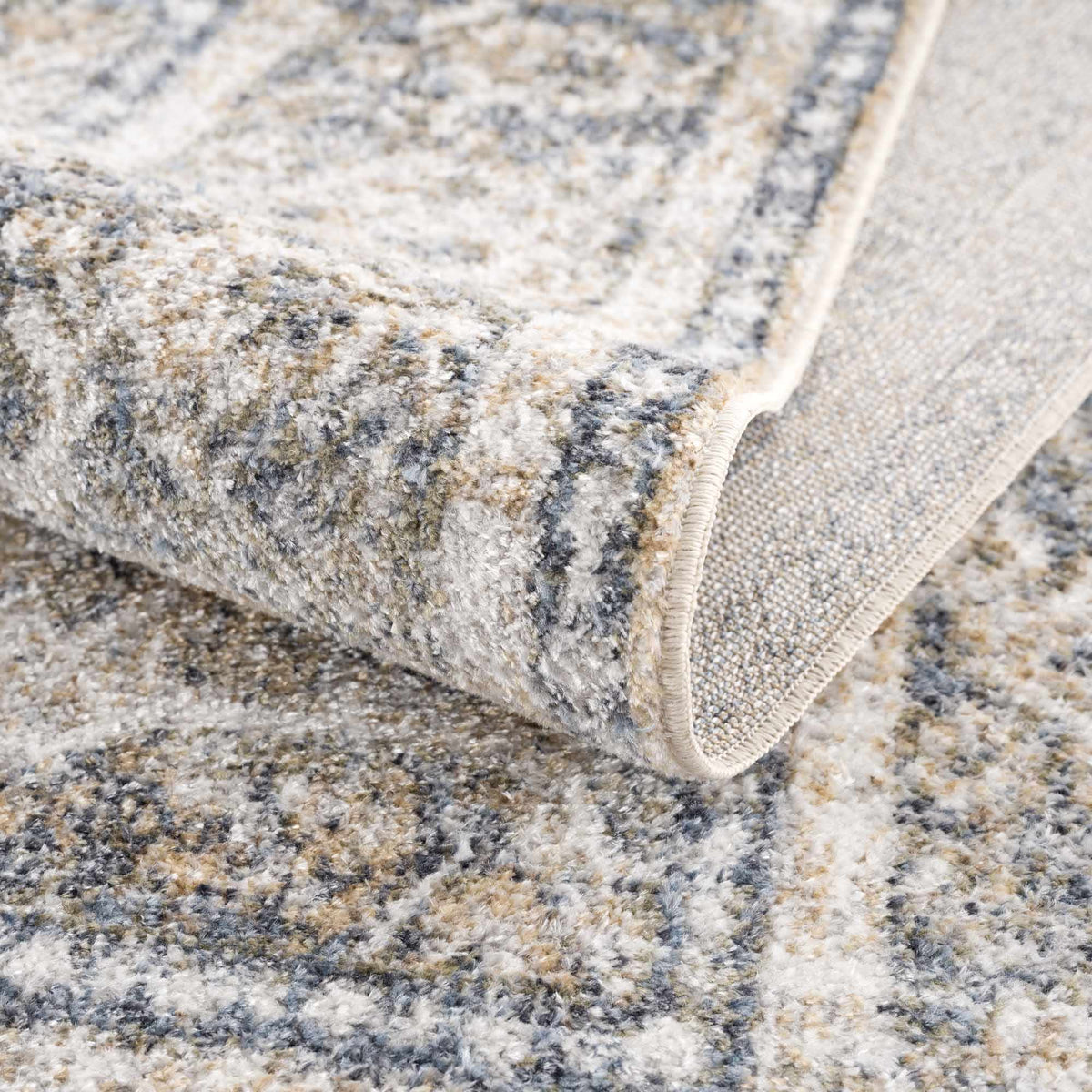 Folded washable rug from Arias Boutique Rugs, showcasing soft texture and stylish design in a neutral color.