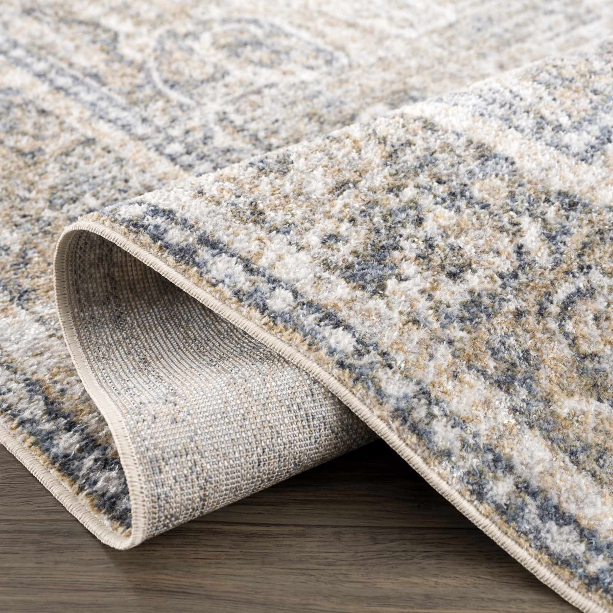 Folded washable rug from Arias Boutique Rugs, showcasing a soft, textured fabric in a cozy, stylish design.