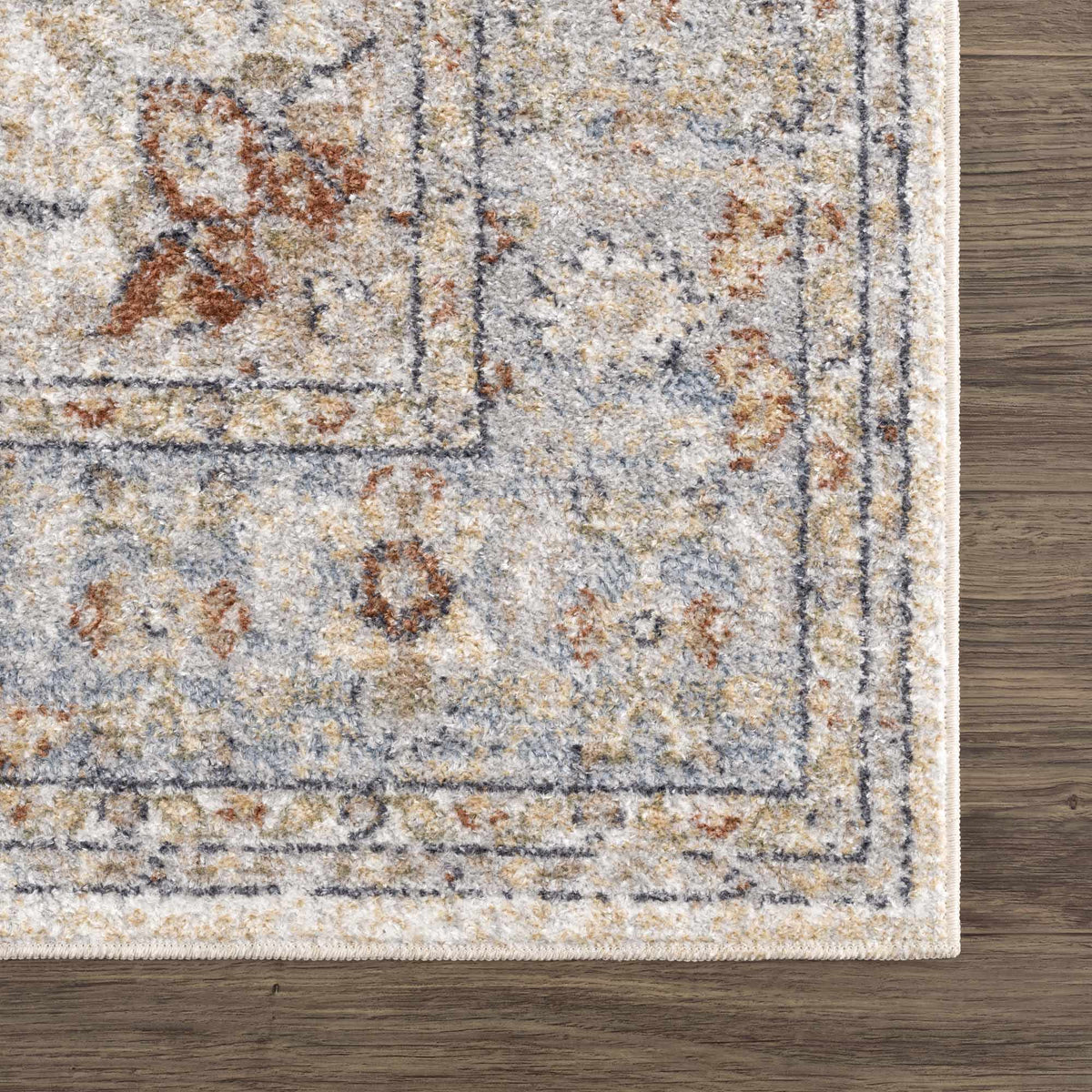 Corner view of the Emke Flat Pile Washable Rug by Boutique Rugs, showcasing its soft texture and neutral color in a modern interior setting.