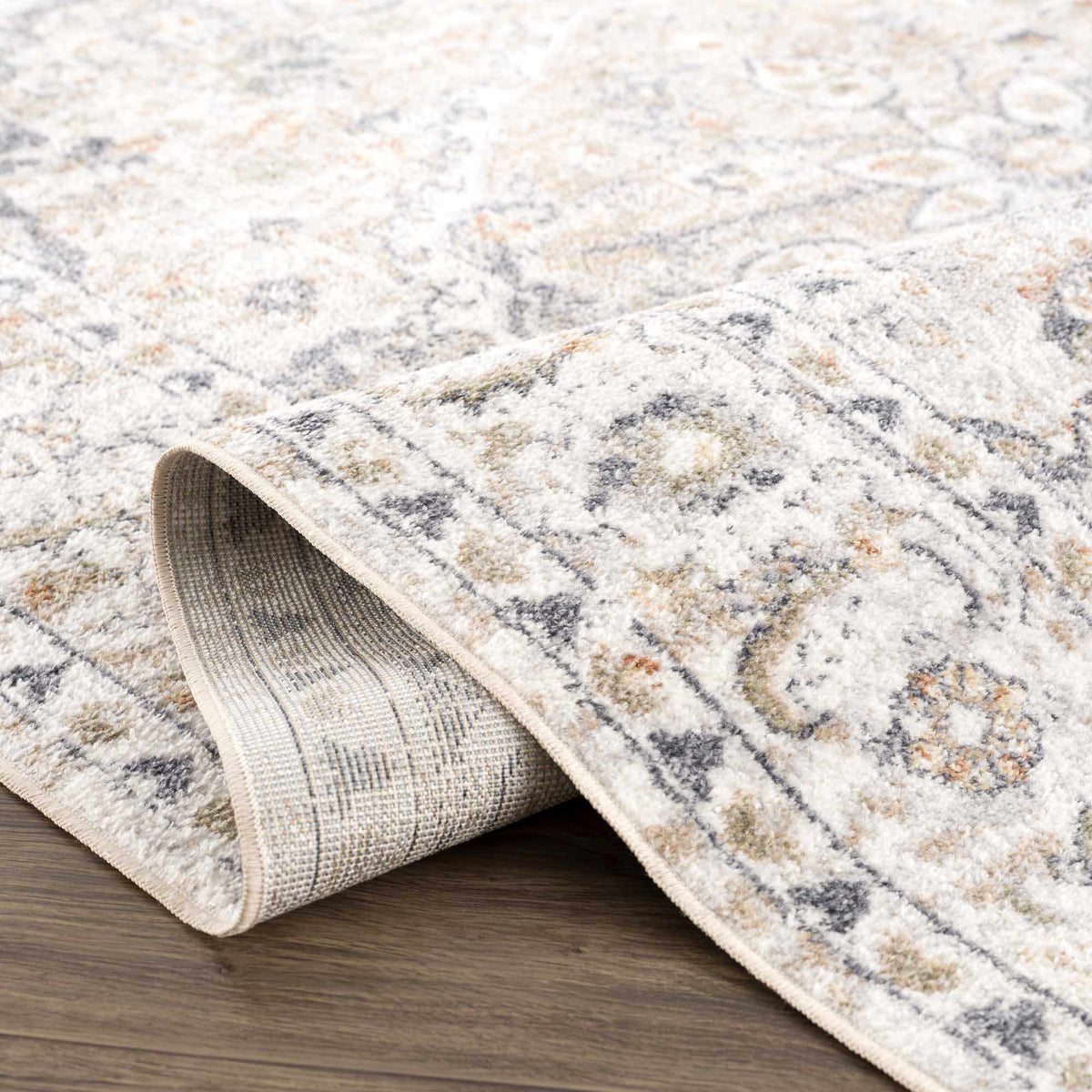Folded Boutique Rugs Hiti Cream flat pile washable rug displayed on studio background.