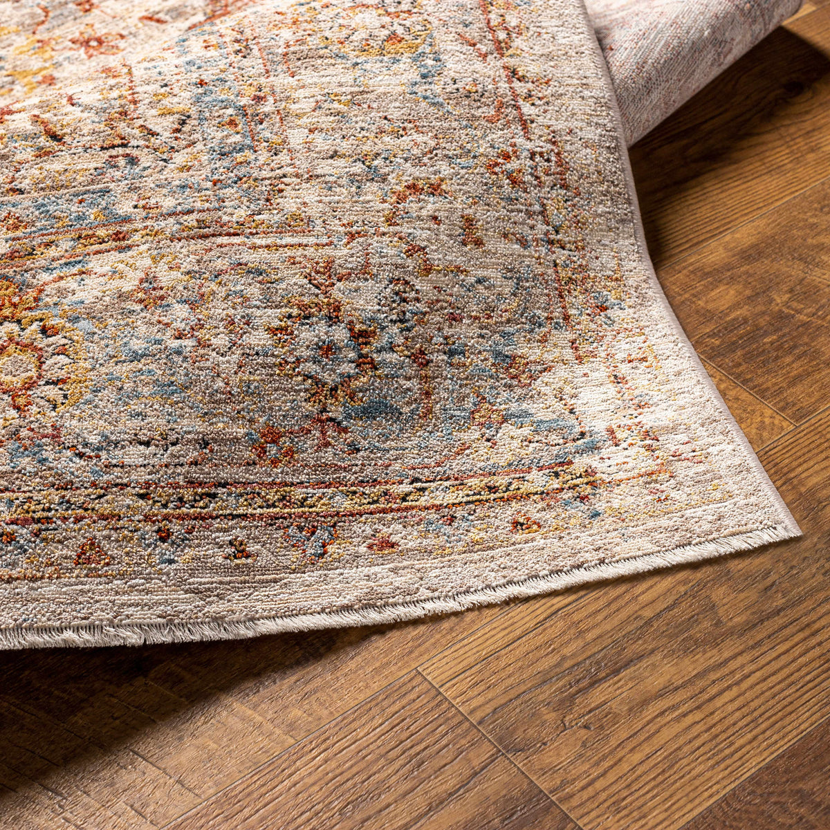 Boutique Rugs Marieville Luxe Performance Rug folded, showcasing soft, plush texture and stylish design in a home decor setting.