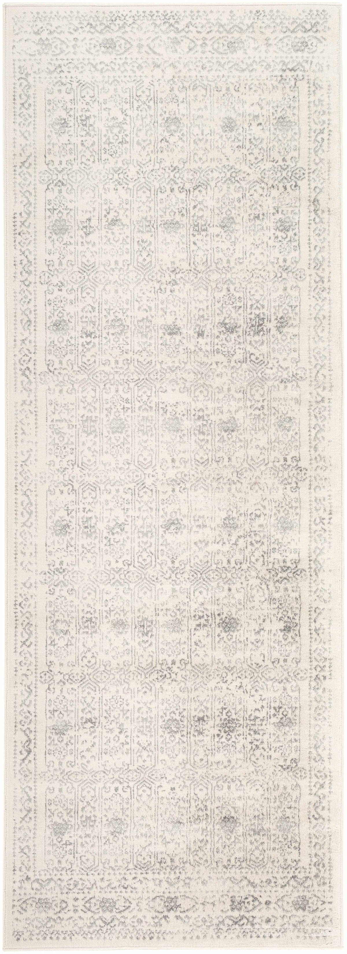 Hauteloom Michie area rug with intricate geometric patterns in neutral tones, showcasing soft woven texture.