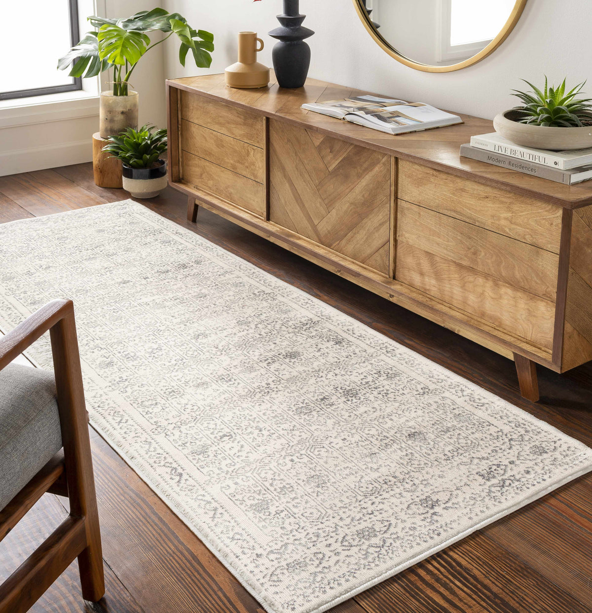 Hauteloom Michie area rug in a modern room scene, featuring a stylish rug with geometric patterns and neutral colors.