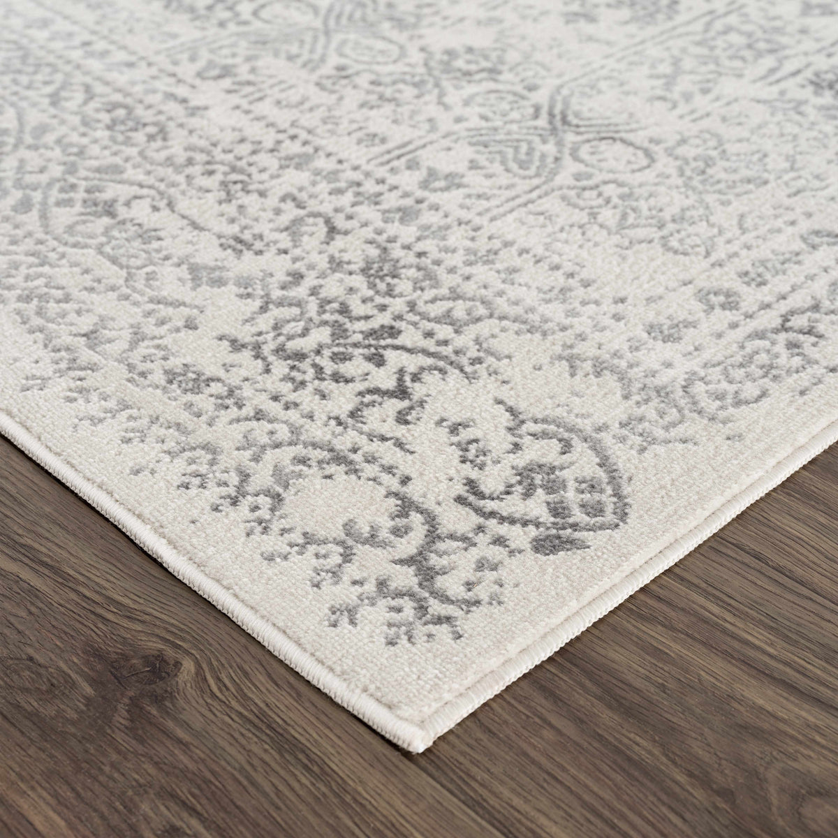 Hauteloom Michie area rug in neutral tones, corner view showcasing textured woven pattern for modern home decor.