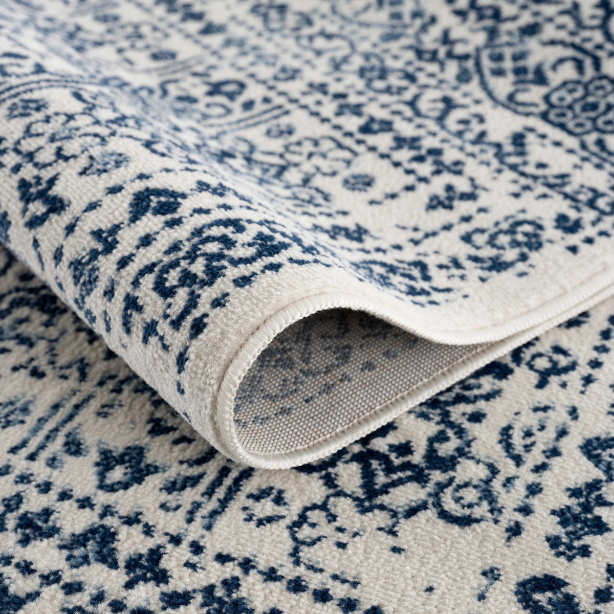 Hauteloom Michie blue area rug with geometric pattern, soft texture, and vibrant color, ideal for living room or bedroom decor.
