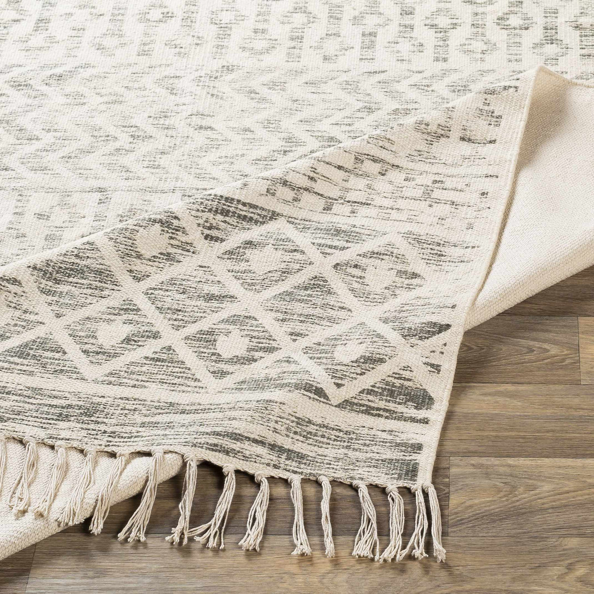 Valyermo beige hand-woven cotton rug by Boutique Rugs, showcasing its textured, natural fiber design on a neutral background.