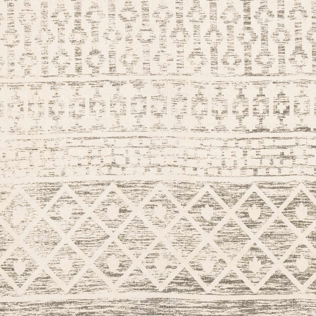 Close-up of a beige hand-woven cotton rug from Boutique Rugs, showcasing its textured, natural fiber design and craftsmanship.