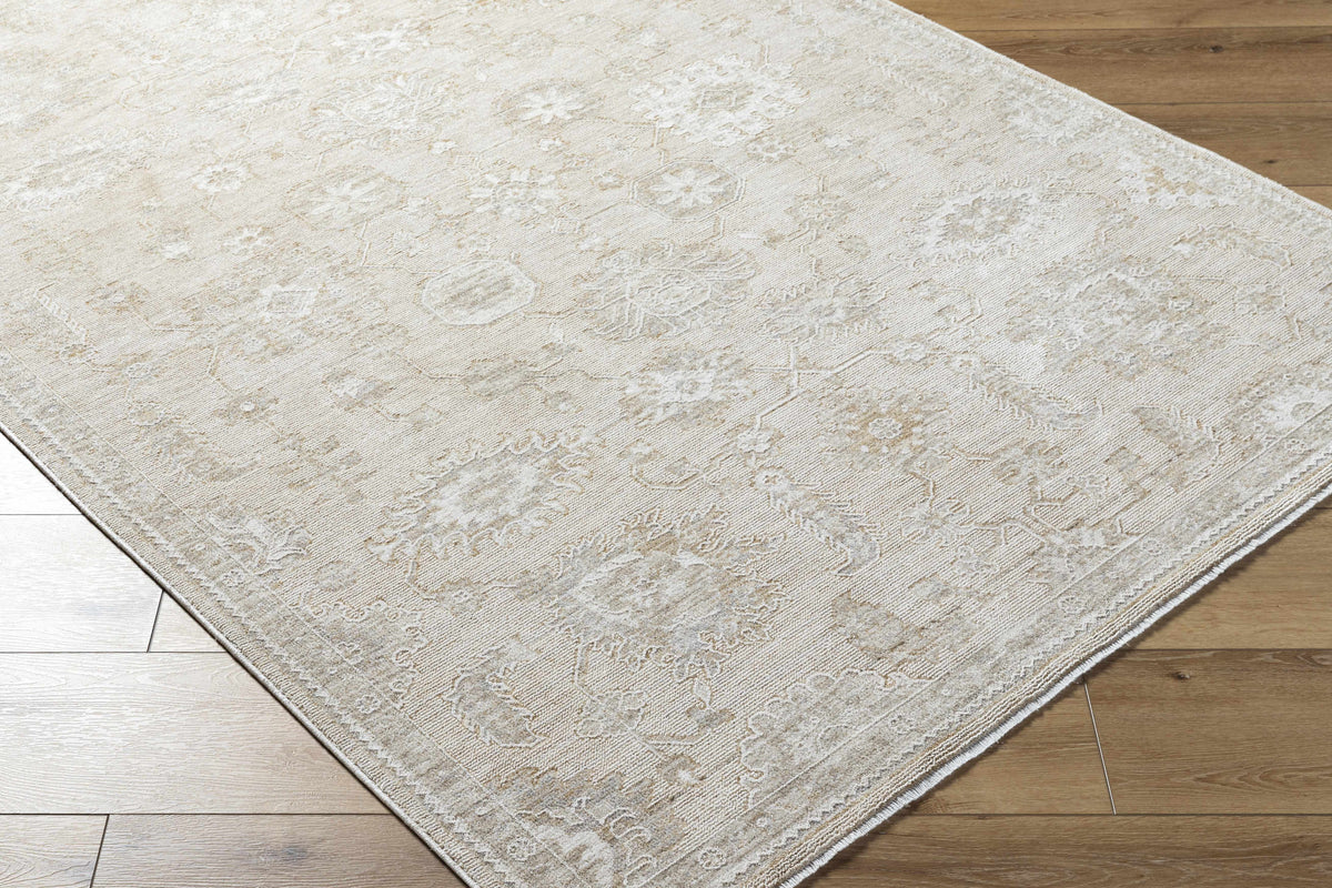 Corner view of the Yonca Luxe Rug by Boutique Rugs, showcasing its textured pattern and rich fabric in a cozy indoor setting.